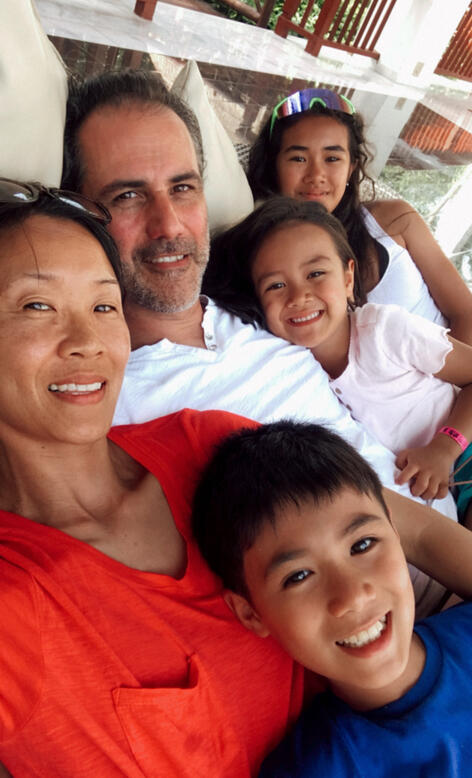 Helen Woo-Duncan Health and Life Coach at Cope Positive Coaching and Author of Twinkle Twinkle Little Heart with her family Helen Woo-Duncan and family